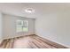 Bright bedroom features wood-look floors and a large window, offering a serene and inviting space at 275 Mountain Way, Covington, GA 30016