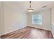 Bright dining area showcases wood-look flooring and a large window offering natural light and views at 275 Mountain Way, Covington, GA 30016