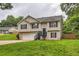 Charming two-story home featuring neutral siding, black shutters, a well-manicured lawn at 275 Mountain Way, Covington, GA 30016