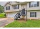Charming two-story home featuring neutral siding, black shutters, a well-manicured lawn at 275 Mountain Way, Covington, GA 30016