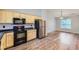Functional kitchen with wooden cabinets, modern appliances, and a convenient layout at 275 Mountain Way, Covington, GA 30016
