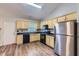 Functional kitchen with wooden cabinets, modern appliances, and a convenient layout at 275 Mountain Way, Covington, GA 30016