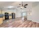 Spacious living area open to the kitchen featuring wood-look floors and plenty of natural light at 275 Mountain Way, Covington, GA 30016