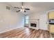 A cozy living room boasts hardwood floors, a fireplace, and natural light, creating an inviting atmosphere at 275 Mountain Way, Covington, GA 30016