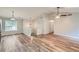 Open concept living space featuring vaulted ceilings, updated flooring, and pendant lighting at 275 Mountain Way, Covington, GA 30016