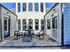 Cozy outdoor patio with pavers and seating area, framed by the house's exterior, creating an inviting space at 3355 Olivia Ct, Cumming, GA 30041