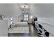 Large attic bedroom featuring a vaulted ceiling, white walls, and modern decor at 3355 Olivia Ct, Cumming, GA 30041