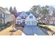Inviting two-story home with a manicured lawn, attached two-car garage, and a welcoming entrance at 3355 Olivia Ct, Cumming, GA 30041