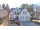 Charming two-story home with a well-maintained front yard, two-car garage and lovely landscaping at 3355 Olivia Ct, Cumming, GA 30041