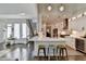 Open floor plan kitchen featuring an island with bar stools and stainless steel appliances at 3355 Olivia Ct, Cumming, GA 30041