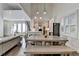 Open floor plan with a view of the kitchen, dining area, and seating area with large windows at 3355 Olivia Ct, Cumming, GA 30041