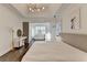 Bright main bedroom featuring tray ceilings, hardwood floors, and a separate office space at 3355 Olivia Ct, Cumming, GA 30041