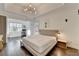 Spacious main bedroom featuring tray ceilings, hardwood floors, and a separate office space at 3355 Olivia Ct, Cumming, GA 30041