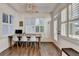 Bright home office featuring a desk under many windows with stylish light fixture at 3355 Olivia Ct, Cumming, GA 30041