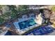 Community pool featuring covered cabanas, lounge chairs, and accessible parking, ideal for relaxation and social gatherings at 3355 Olivia Ct, Cumming, GA 30041