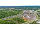 Aerial view of a neighborhood showcasing well-maintained homes and lush greenery at 6370 Cortland Walk, Alpharetta, GA 30005