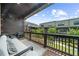Cozy balcony featuring a seating area and views of the surrounding community at 6370 Cortland Walk, Alpharetta, GA 30005