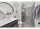 Modern bathroom with frameless glass shower, sleek vanity, and stylish fixtures at 6370 Cortland Walk, Alpharetta, GA 30005