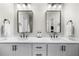 Modern bathroom with double sinks, white cabinets, and sleek black hardware and fixtures at 6370 Cortland Walk, Alpharetta, GA 30005