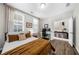 Comfortable bedroom featuring a dedicated work area and easy access to entryway at 6370 Cortland Walk, Alpharetta, GA 30005
