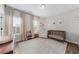 Bright Bedroom featuring crib, chair, changing table, and large windows with natural light at 6370 Cortland Walk, Alpharetta, GA 30005