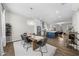 Open-concept dining room with modern chandelier and seamless transition to the kitchen at 6370 Cortland Walk, Alpharetta, GA 30005