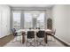 Elegant dining area featuring a modern chandelier and ample natural light at 6370 Cortland Walk, Alpharetta, GA 30005