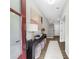 Bright entryway with stylish console table, runner, and staircase access at 6370 Cortland Walk, Alpharetta, GA 30005