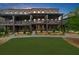 Attractive brick townhomes feature private terraces overlooking a manicured lawn at 6370 Cortland Walk, Alpharetta, GA 30005