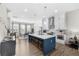 Modern kitchen featuring an island with seating, stainless steel appliances, and hardwood floors at 6370 Cortland Walk, Alpharetta, GA 30005