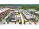 Aerial view of a vibrant retail area with shops, restaurants, and parking, surrounded by trees and greenery at 6370 Cortland Walk, Alpharetta, GA 30005