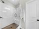 Clean, bright shower with white subway tile, glass door, and a built-in bench at 6370 Cortland Walk, Alpharetta, GA 30005