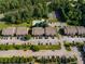 Aerial view of multi-Gathering community with pool, tennis court, parking lots, and lush surrounding trees at 7712 Autry Cir # 701, Douglasville, GA 30134