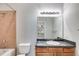 Well-lit bathroom with a granite counter, tile floors, and combination tub and shower at 7712 Autry Cir # 701, Douglasville, GA 30134