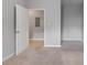 Neutral bedroom with an open door that leads to the utility area at 7712 Autry Cir # 701, Douglasville, GA 30134
