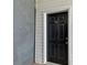 Close-up of a black apartment door with white trim and the number 701 on the front at 7712 Autry Cir # 701, Douglasville, GA 30134