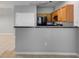 Open kitchen area with a raised breakfast bar, offering a clear view into the adjacent dining and living areas at 7712 Autry Cir # 701, Douglasville, GA 30134