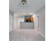 Open-concept living space connects seamlessly to a kitchen area with tile flooring and neutral color palette at 7712 Autry Cir # 701, Douglasville, GA 30134