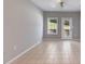 Bright and airy living room featuring tile floors, neutral walls, and natural light from a nearby window and door at 7712 Autry Cir # 701, Douglasville, GA 30134