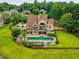 Beautiful house with a pool, a large yard, a stone retaining wall and plenty of privacy at 2675 Portabella Ln, Cumming, GA 30041