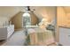 Bright bedroom with two twin beds, complemented by a large arched window and ceiling fan at 2675 Portabella Ln, Cumming, GA 30041