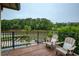 Comfortable deck with lake views and chairs for relaxing by the water at 2675 Portabella Ln, Cumming, GA 30041