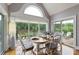 Charming dining area with elegant chairs, large windows, and access to the outdoor deck with scenic views at 2675 Portabella Ln, Cumming, GA 30041