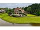 Well-maintained home on a spacious lot with a large pool, offering a perfect blend of luxury and natural beauty at 2675 Portabella Ln, Cumming, GA 30041