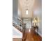 Grand foyer boasts hardwood floors, soaring ceilings, elegant chandelier, and staircase at 2675 Portabella Ln, Cumming, GA 30041