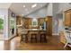 Spacious kitchen boasts wooden cabinets, center island, and stainless steel appliances, ideal for cooking and gathering at 2675 Portabella Ln, Cumming, GA 30041