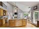 Spacious kitchen with an island and natural light, with views into the living spaces at 2675 Portabella Ln, Cumming, GA 30041