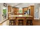 Well-equipped kitchen featuring wooden cabinets, granite countertops, and modern appliances for seamless cooking experiences at 2675 Portabella Ln, Cumming, GA 30041
