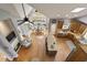 Aerial view of the kitchen featuring wood cabinets, a center island and a cozy fireplace seating area at 2675 Portabella Ln, Cumming, GA 30041