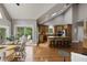 Open concept kitchen and dining area with hardwood floors, ideal for Gathering meals and entertaining guests at 2675 Portabella Ln, Cumming, GA 30041